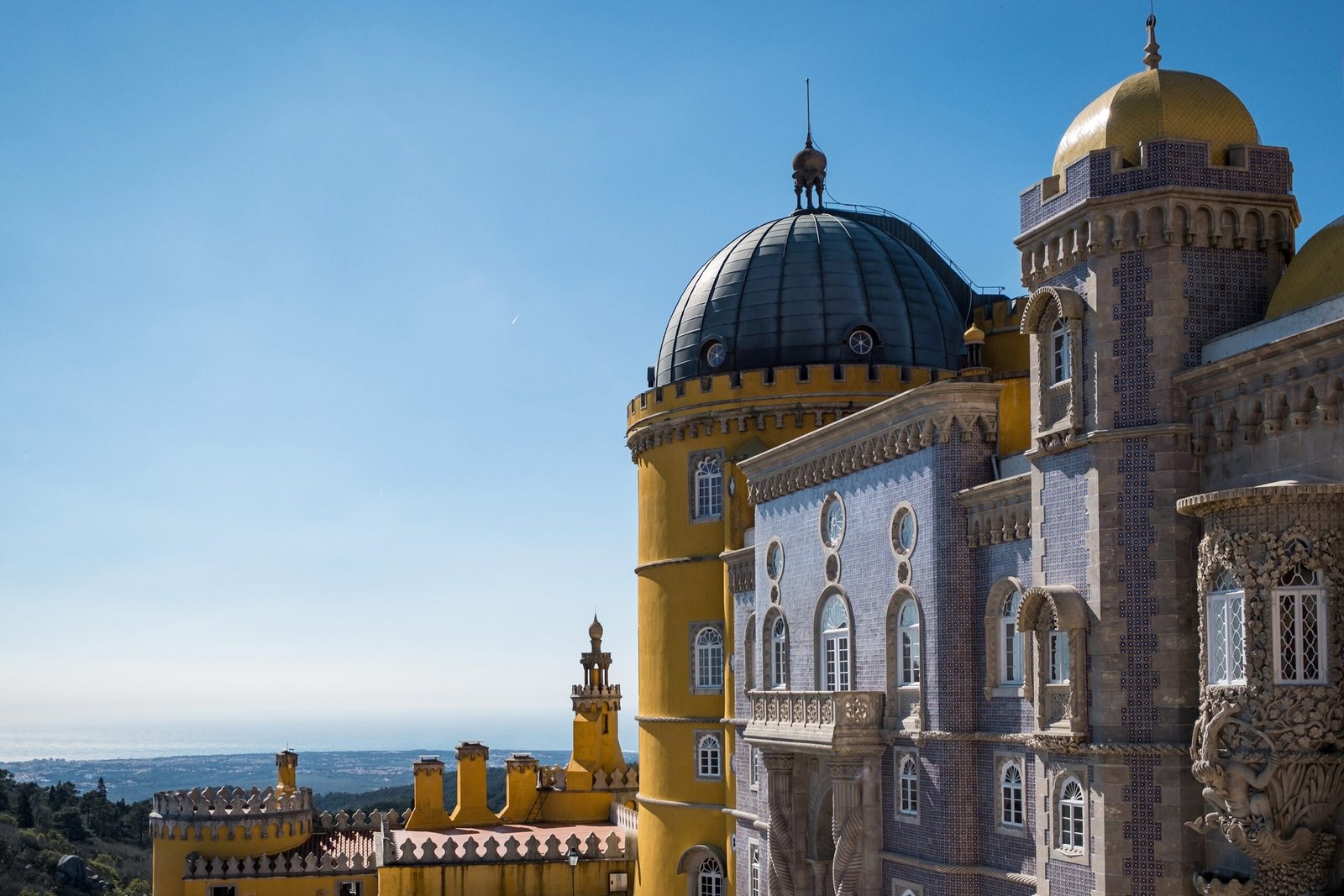 The castle in Sintra Cascais surrounded by greenery under the sunlight and a blue sky in Portugal