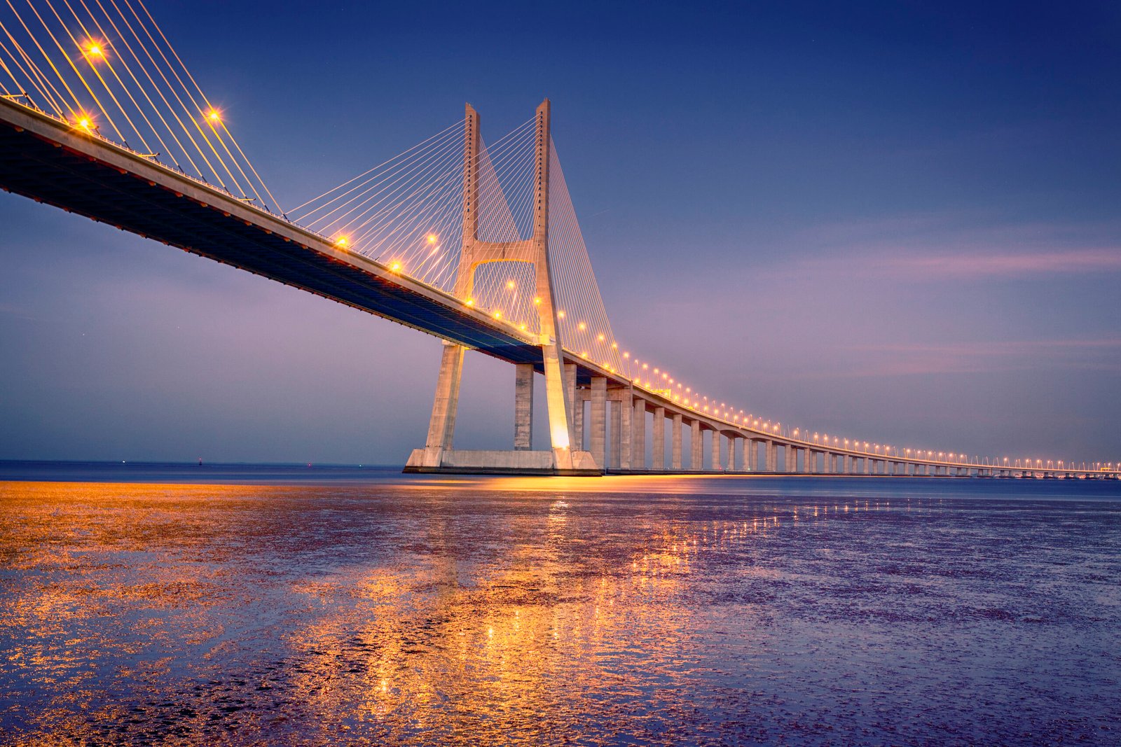 sunrise on Vasco da Gama bridge in Lisbon, Portugal